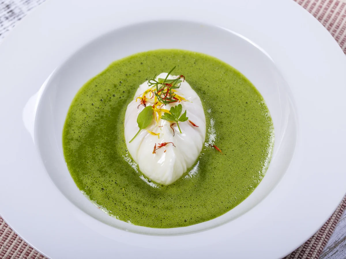 green-sauce-with-poached-egg-white-plate